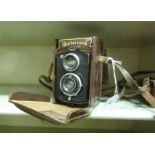 A Rolleicord Reflex camera, in a moulded