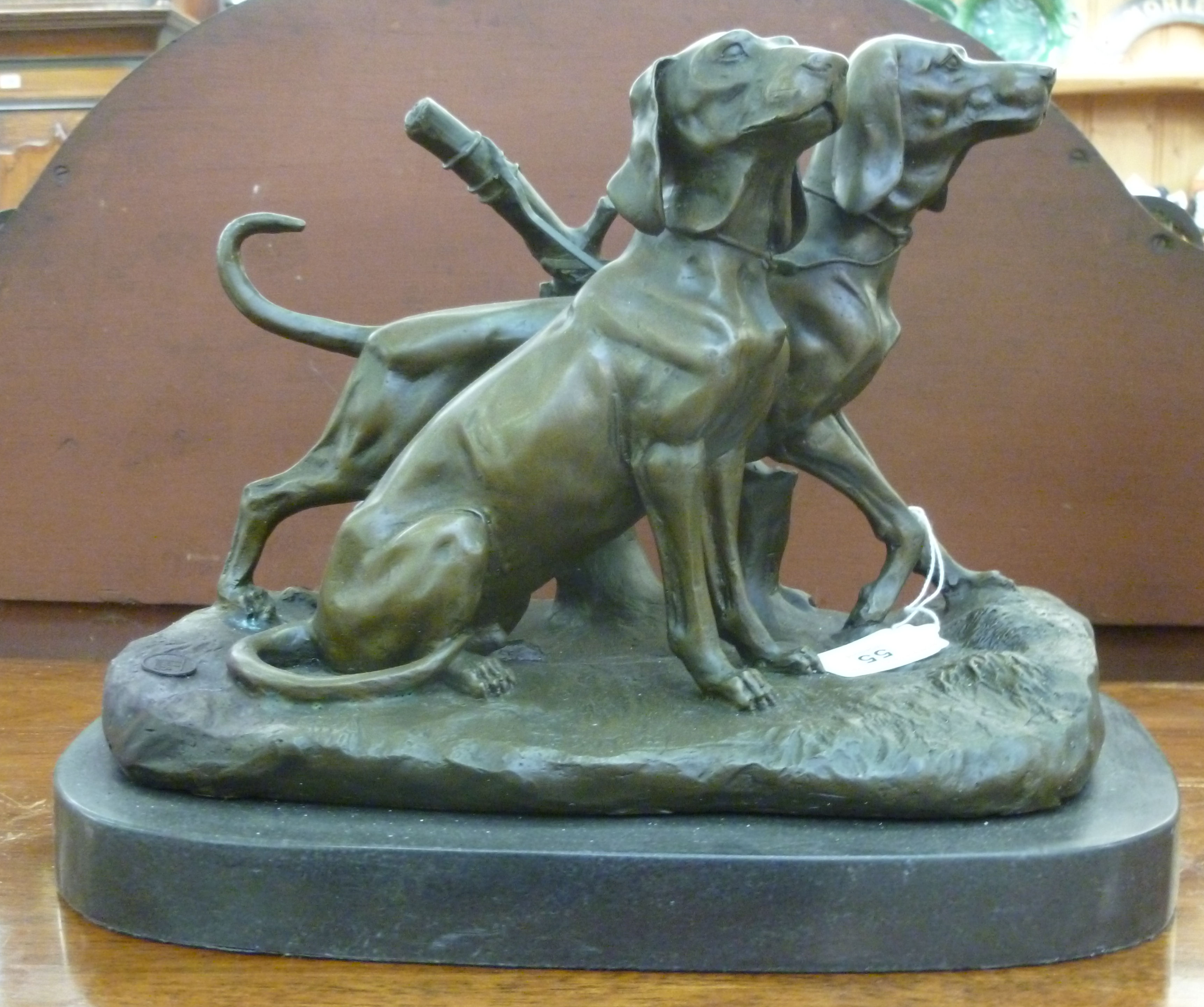 A cast and patinated bronze model, two L