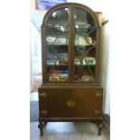 An early 20thC oak display cabinet, havi