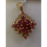 A 9ct gold ruby coloured and diamond set
