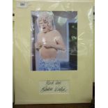 A photograph of Barbara Windsor, above h