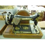 An early 20thC Singer manual sewing mach