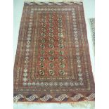 A Bokhara rug with stylised motifs on a