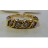 A 14ct four stone, scroll set diamond ri