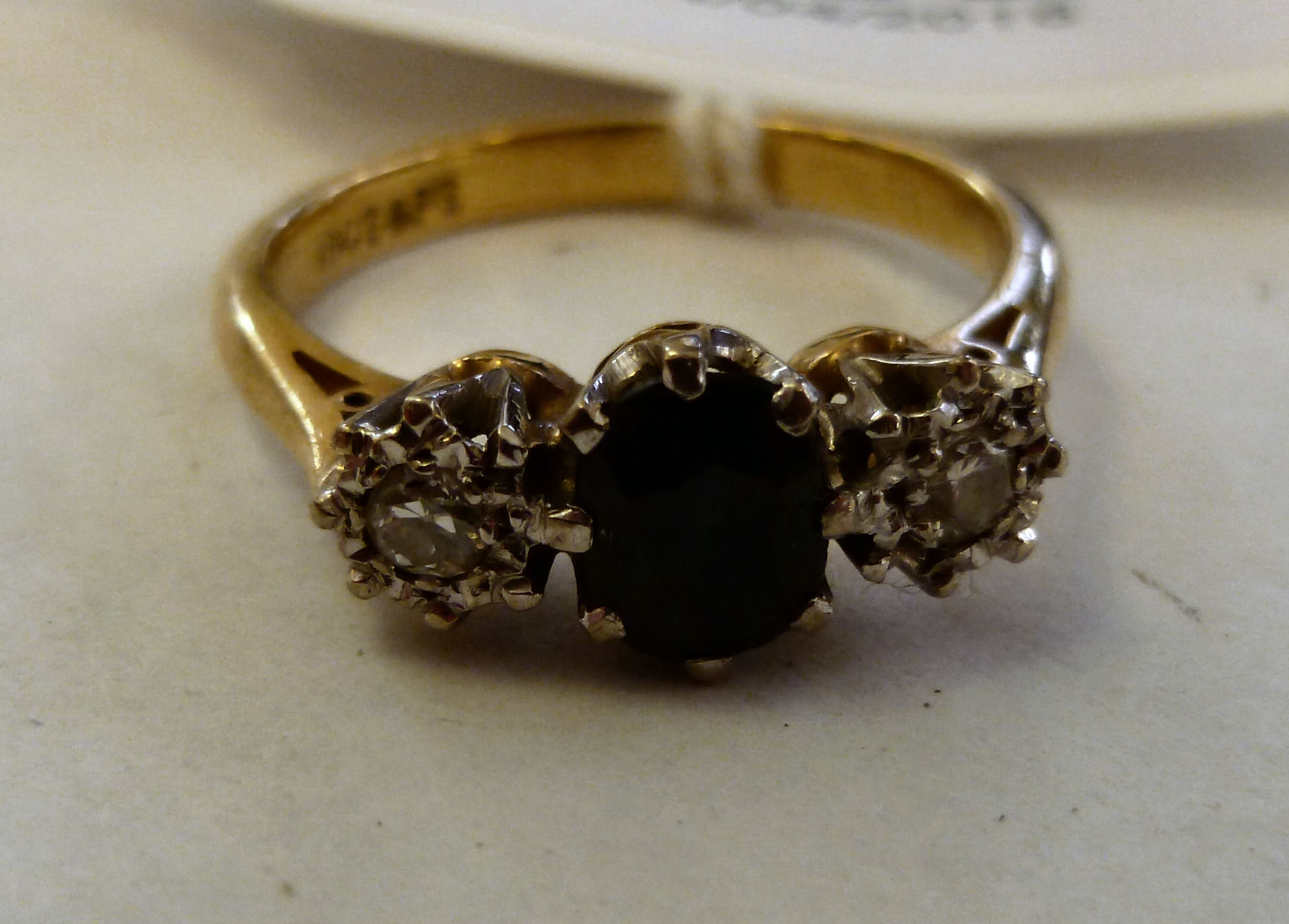 An 18ct gold ring, claw set with a sapph