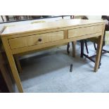 A modern light oak finished two drawer s