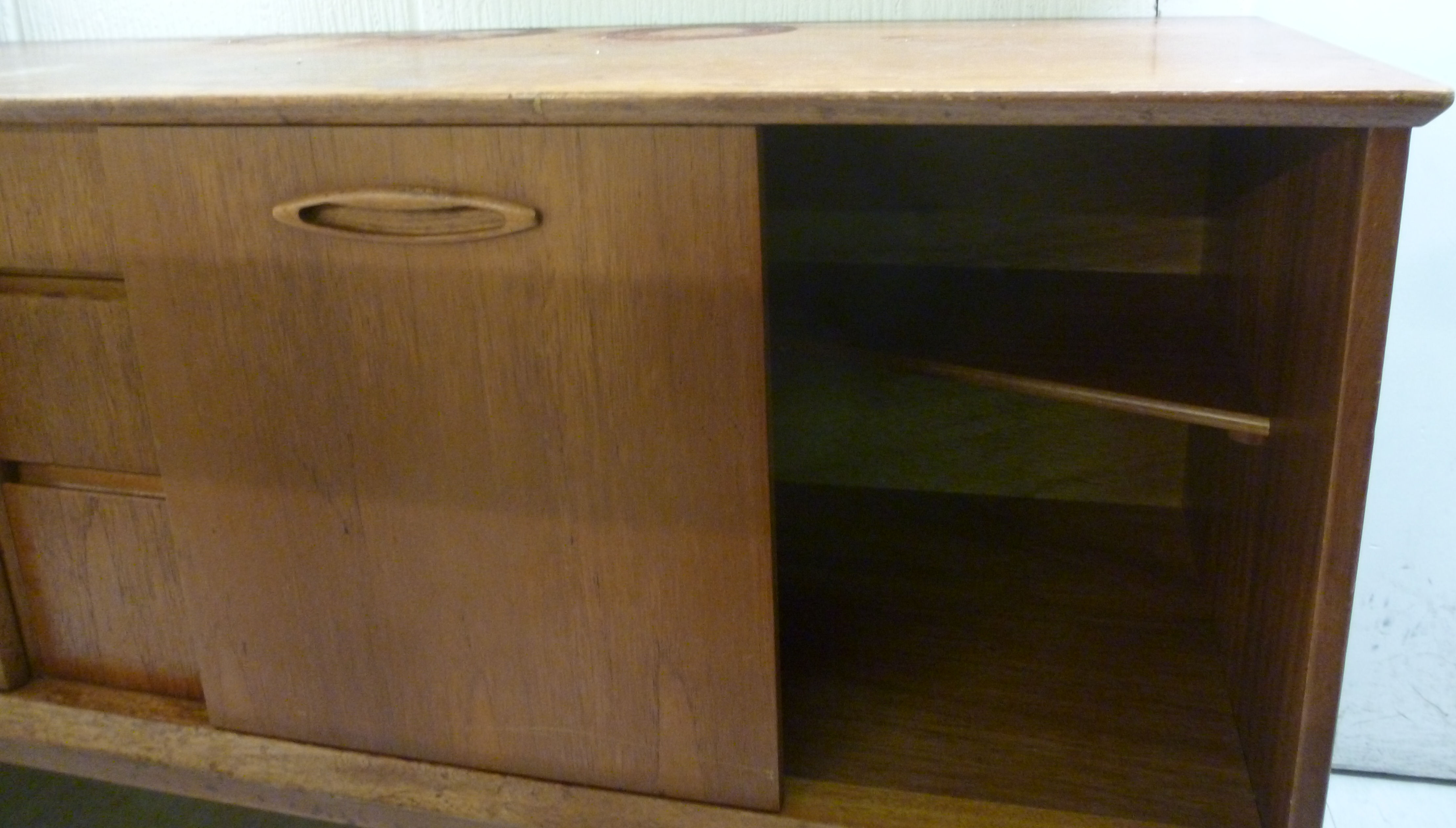 A 1970s teak sideboard, having three cen - Image 2 of 3