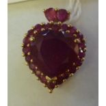 A 9ct gold ruby set, heart shaped pendan