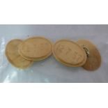 A pair of 18ct gold oval tablet and chai