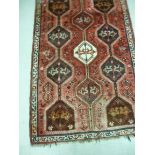 An Indian woollen rug with stylised moti