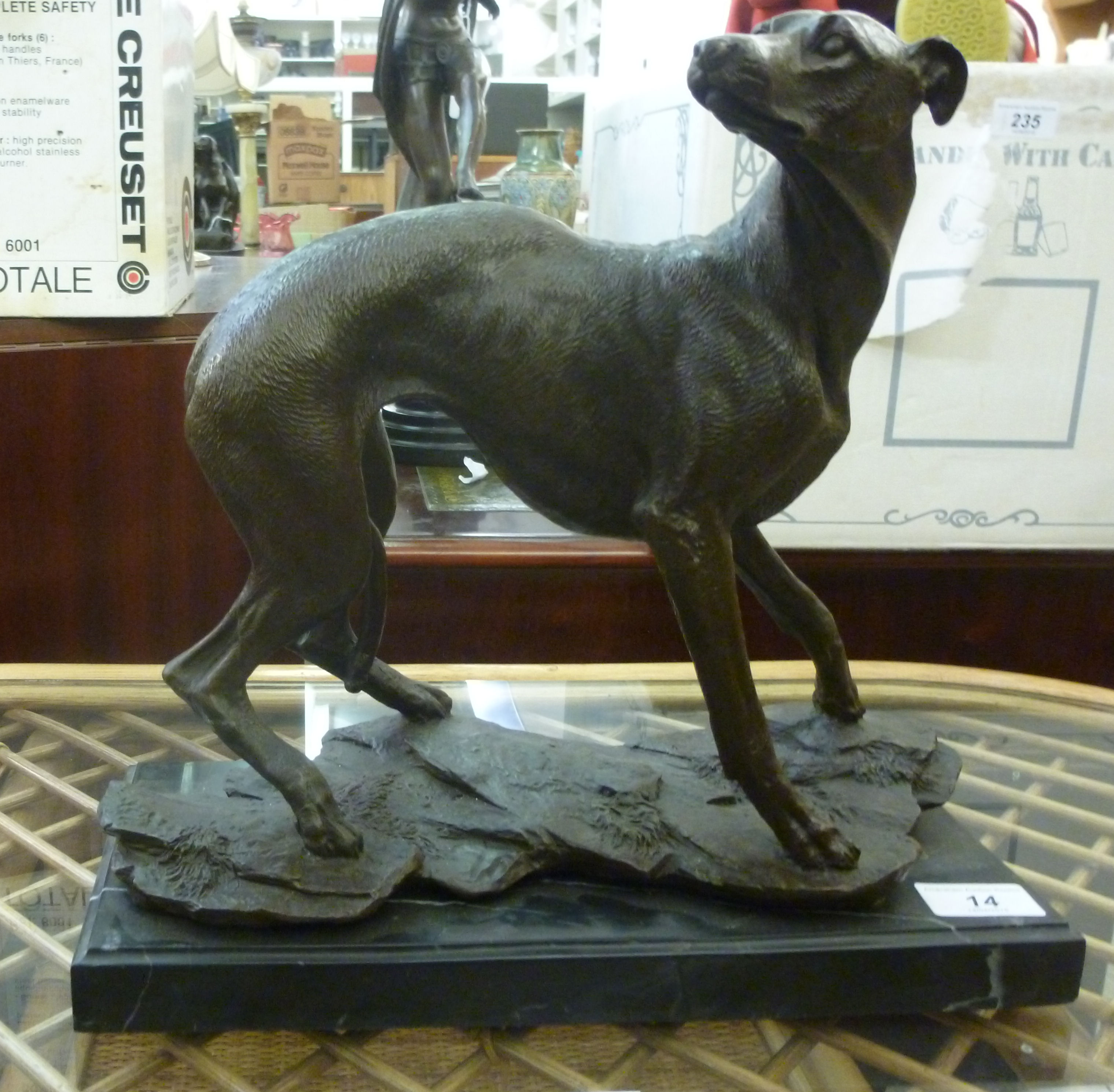 A cast and patinated bronze model greyho