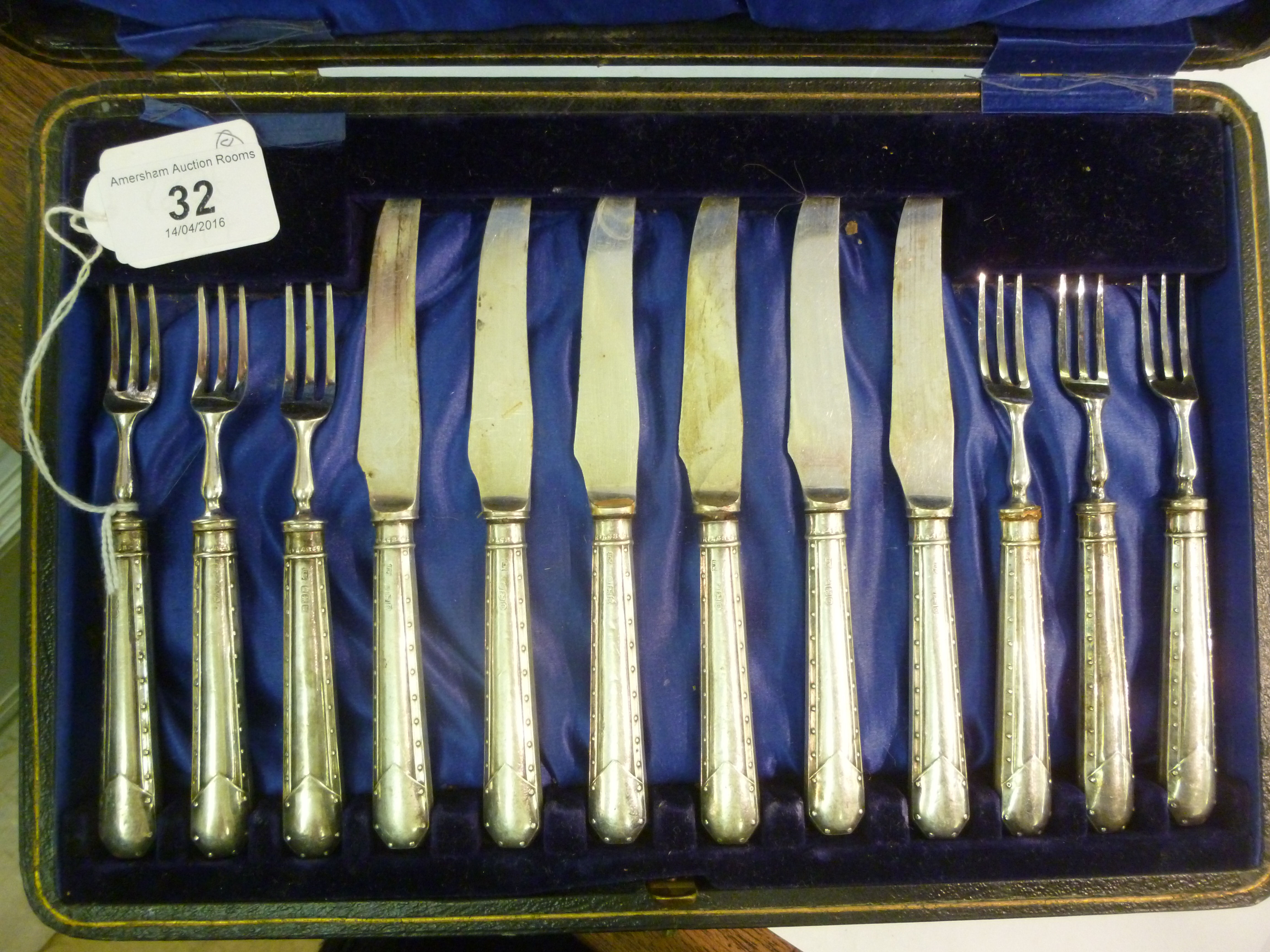 A set of six stainless steel fish knives