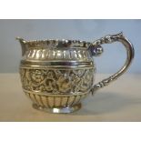 A late Victorian silver cream jug of ova