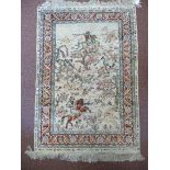 A Persian silk mat, featuring four mount
