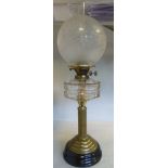 An early 20thC oil lamp, the brass burne