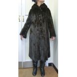 A mink coat, having a rolled collar, a b