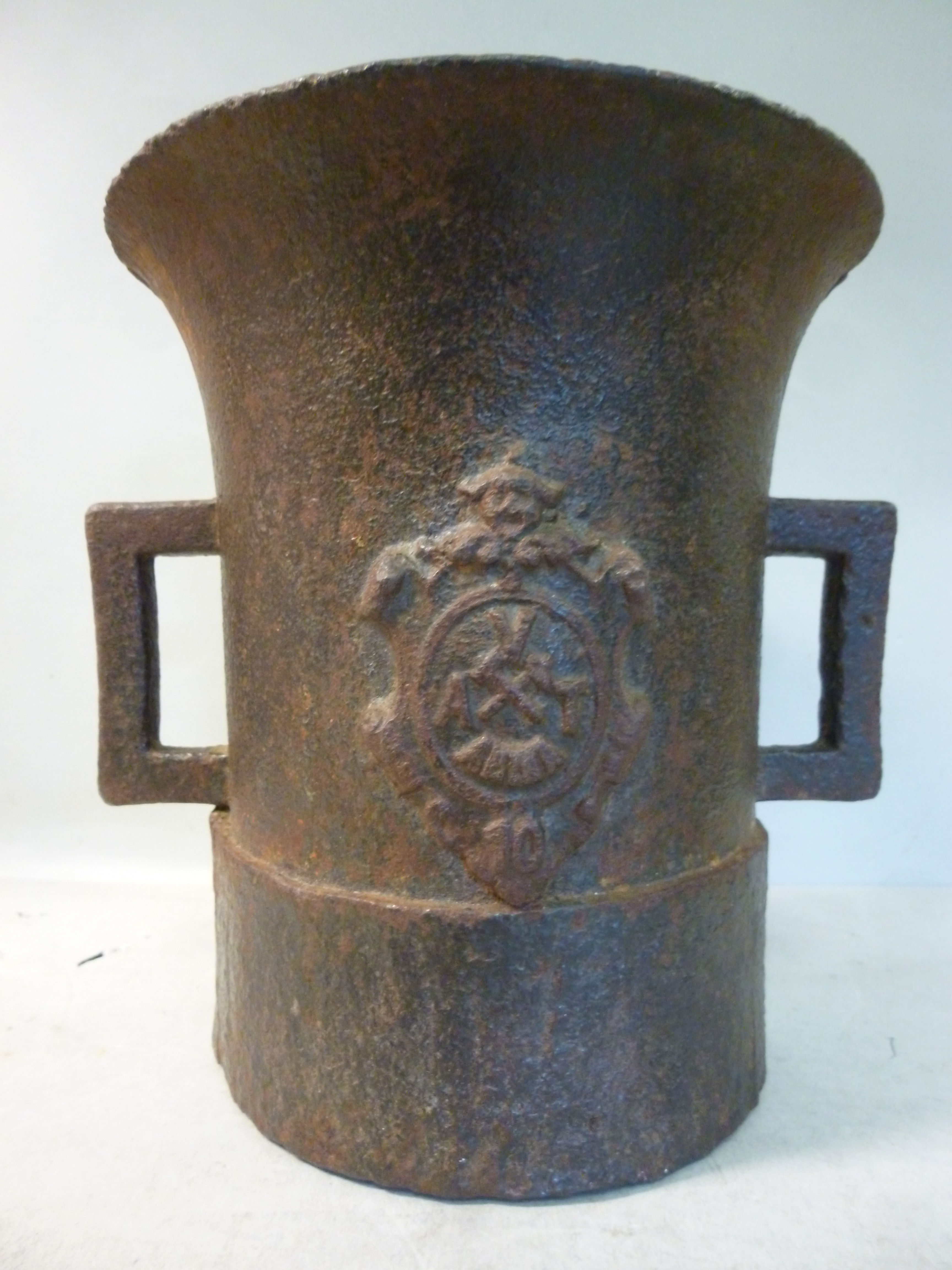 A 17thC cast iron mortar of cylindrical