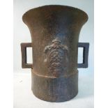 A 17thC cast iron mortar of cylindrical