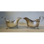 A pair of silver sauce boats, having dec