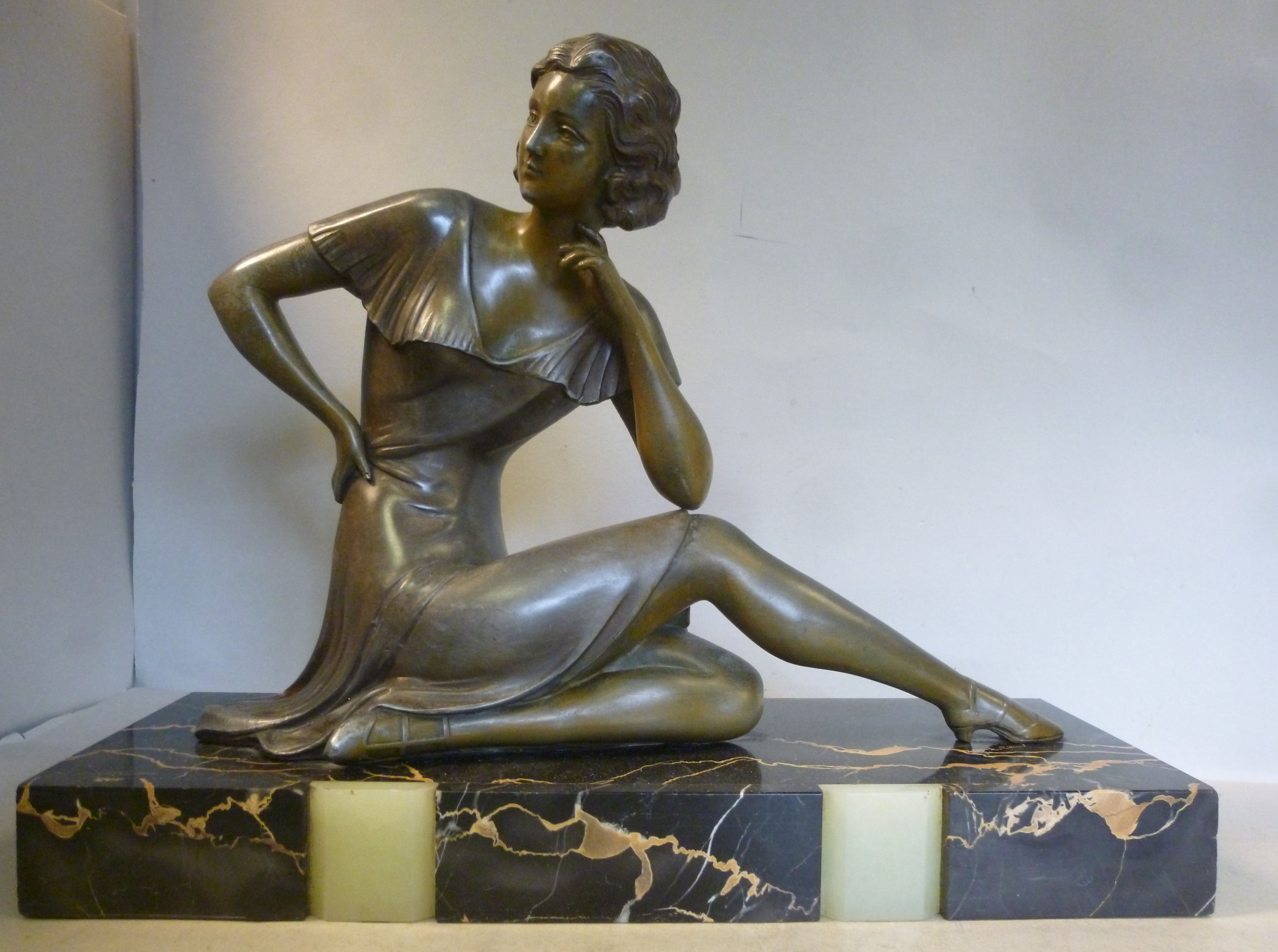 An Art Deco cast and patinated spelter f