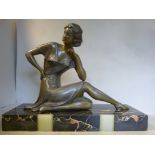 An Art Deco cast and patinated spelter f