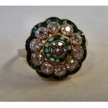 A 14ct gold emerald and diamond set clus