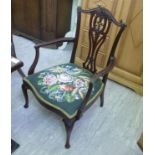 An Edwardian mahogany framed salon chair