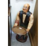 A painted composition model, a waiter ho