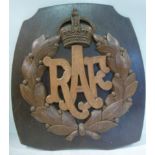 A carved and stained oak RAF emblem, on