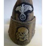 A World War II SS side cap (owner's labe