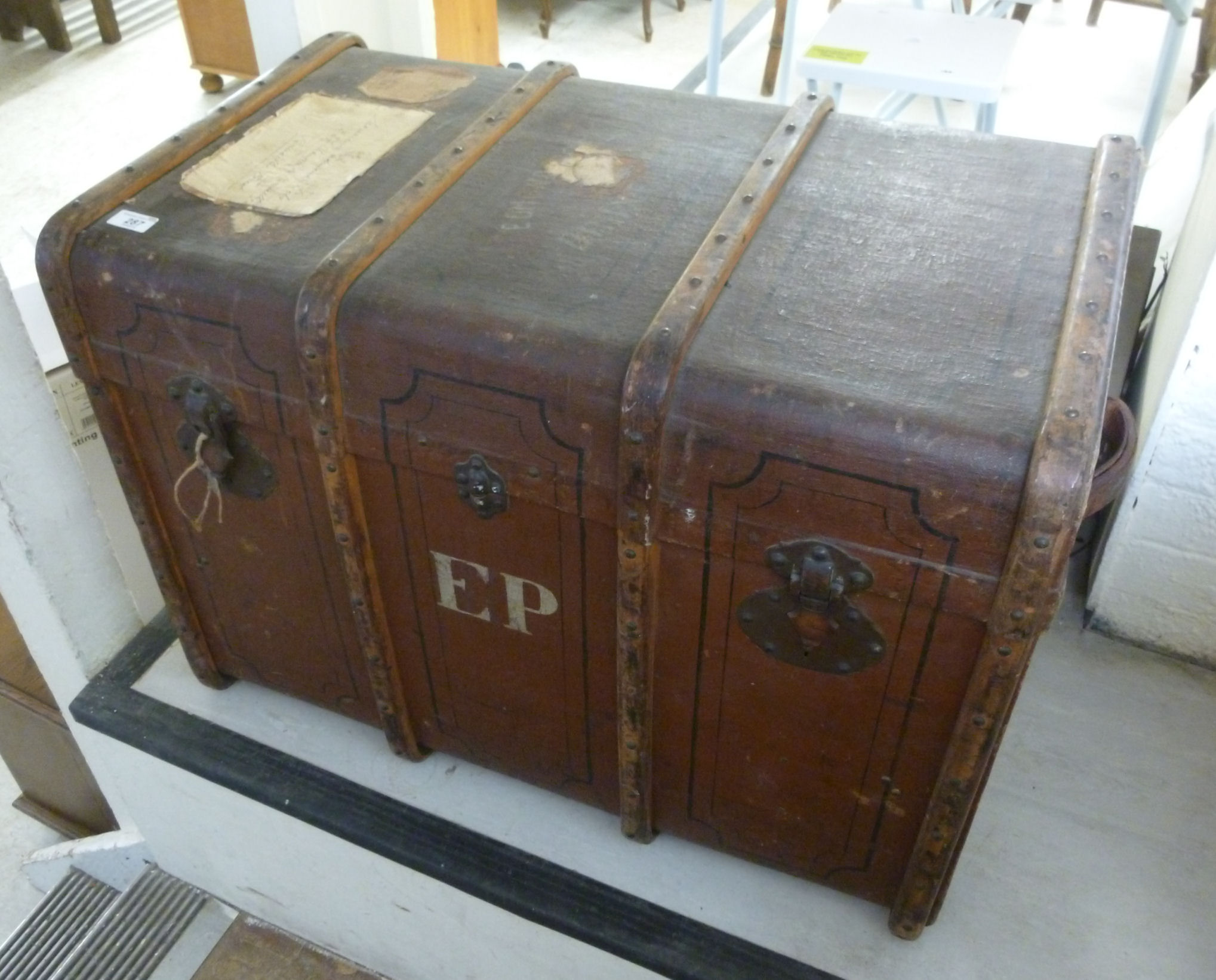 An early 20thC canvas clad trunk with st