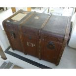 An early 20thC canvas clad trunk with st