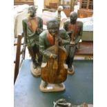 Three painted composition band figures,