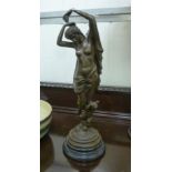 A cast and patinated bronze figure, a cl