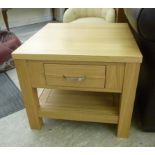 A pair of modern pale oak lamp tables wi