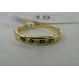 An 18ct gold eternity ring, set with alt