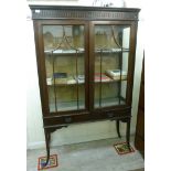 An Edwardian mahogany fully glazed displ