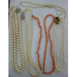 Four various pearl necklaces and a coral