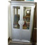 A modern painted silver display cabinet,