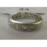 An 18ct white gold eternity ring, set wi