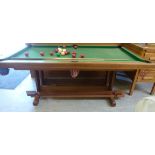 A modern teak, slate bed snooker/dining