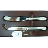 A pair of Carrs steel cheese knives, on