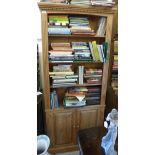 A modern waxed pine bookcase, the three-