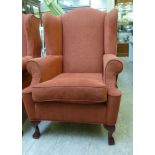 A mid Georgian style wingback armchair,