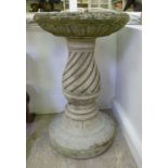 A composition stone bird bath, the shall