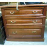 A modern mahogany finished three drawer