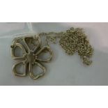 A Tiffany & Co silver floral pendant, on