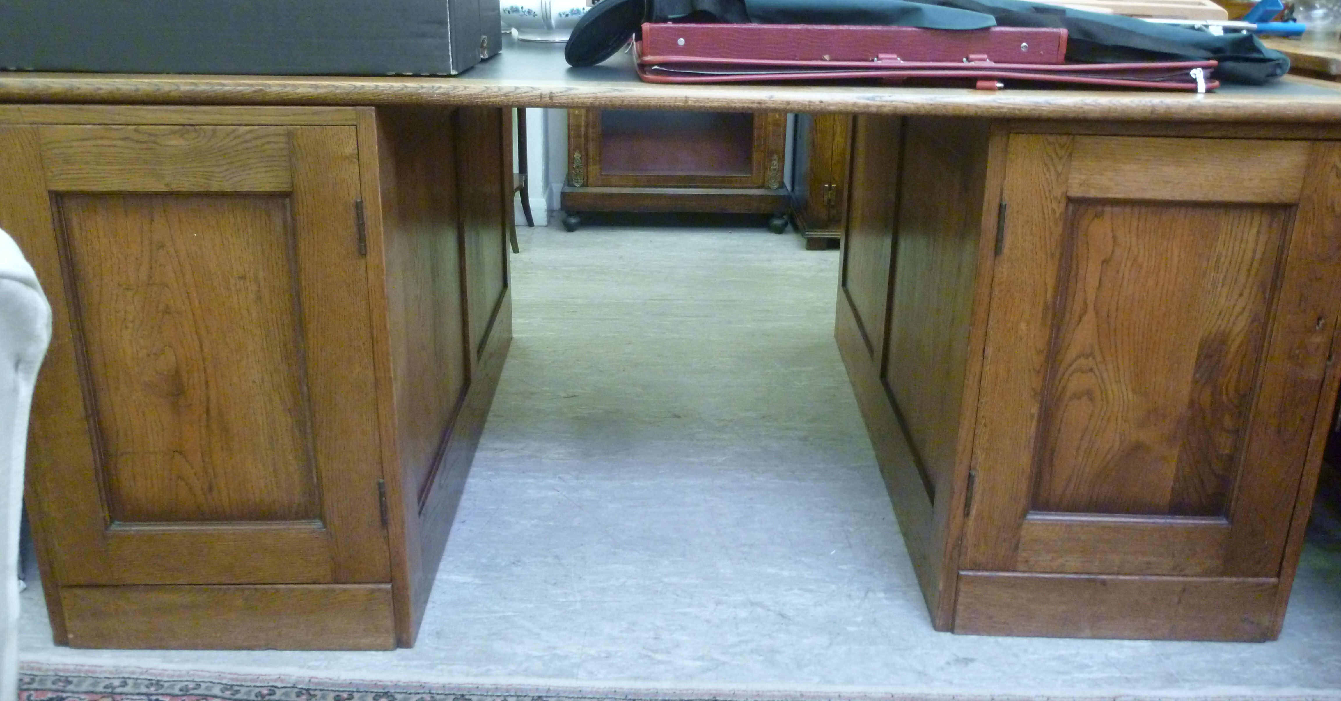 A 1920s oak partners' desk of panelled d - Image 2 of 3