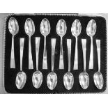 A set of twelve silver coffee spoons wit