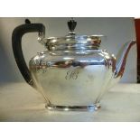 A silver teapot of shouldered, panelled